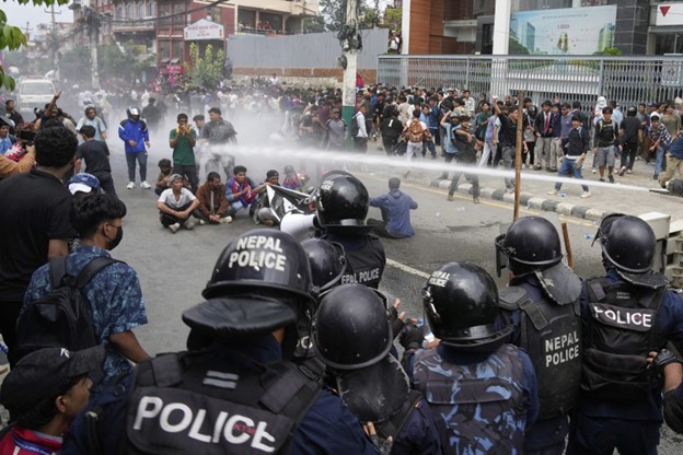 Riot police use a water cannon on protesters outside Parliament in Kathmandu on September 8, 2025.